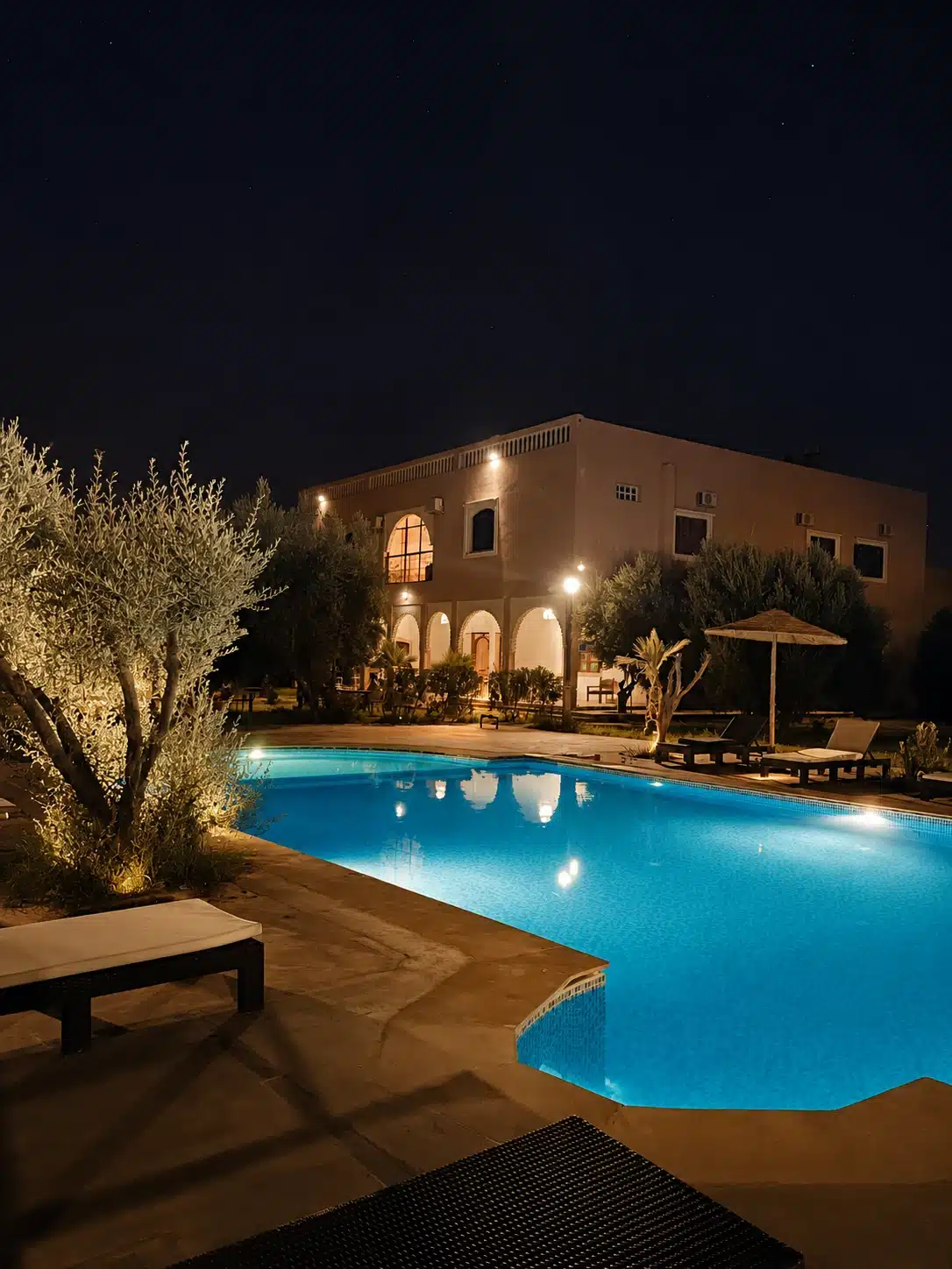 Riad Qodwa swimming pool at night near Marrakech